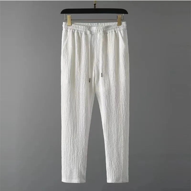 Conjuntos de verano para hombre, traje deportivo fino a la moda, camiseta de Color sólido y pantalones de longitud completa, ropa de calle informal para correr