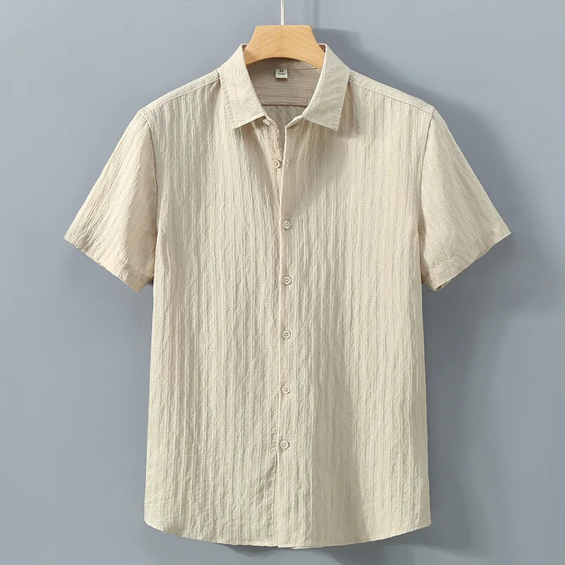 En verano, ropa de protección solar para hombres, camisa de color sólido, mangas cortas transpirables de algodón suelto informal y versátil