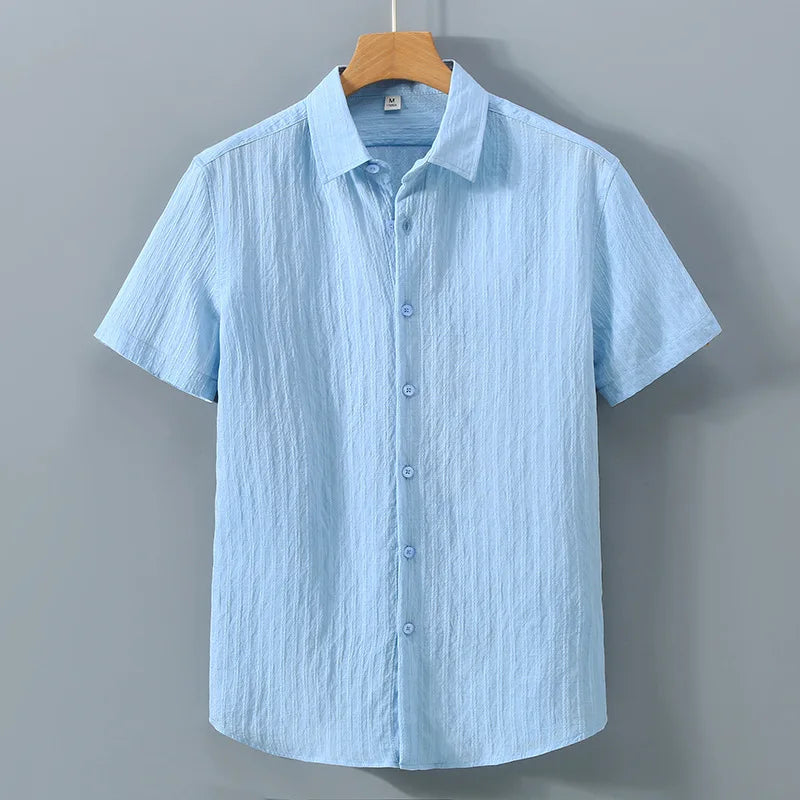 En verano, ropa de protección solar para hombres, camisa de color sólido, mangas cortas transpirables de algodón suelto informal y versátil