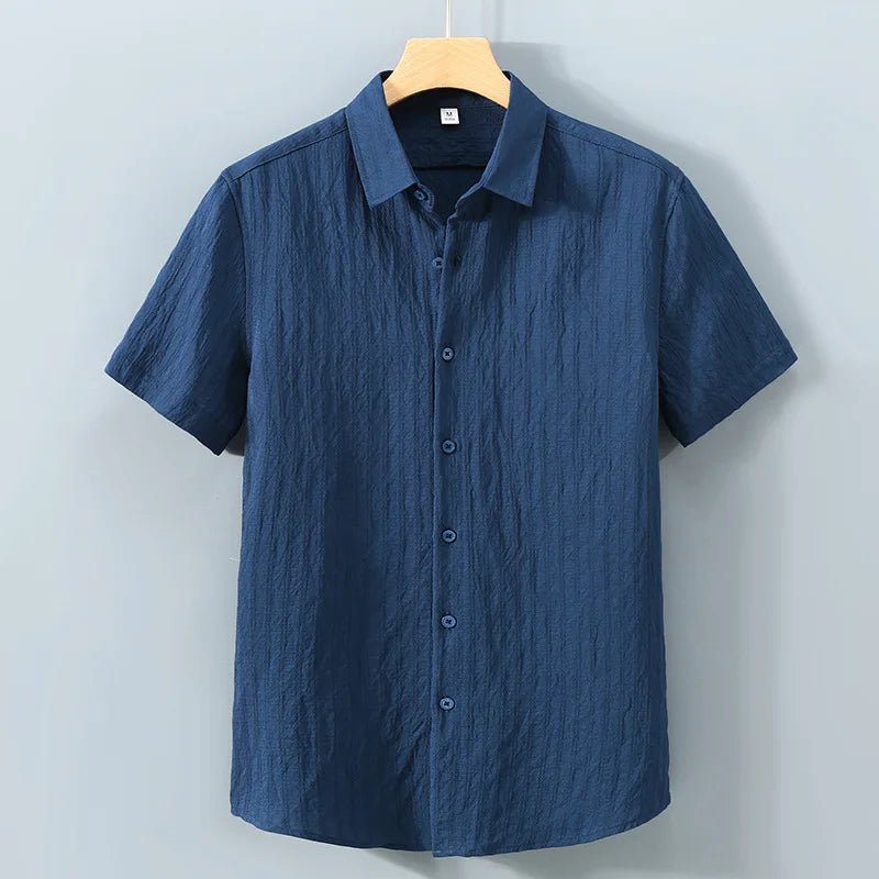 En verano, ropa de protección solar para hombres, camisa de color sólido, mangas cortas transpirables de algodón suelto informal y versátil